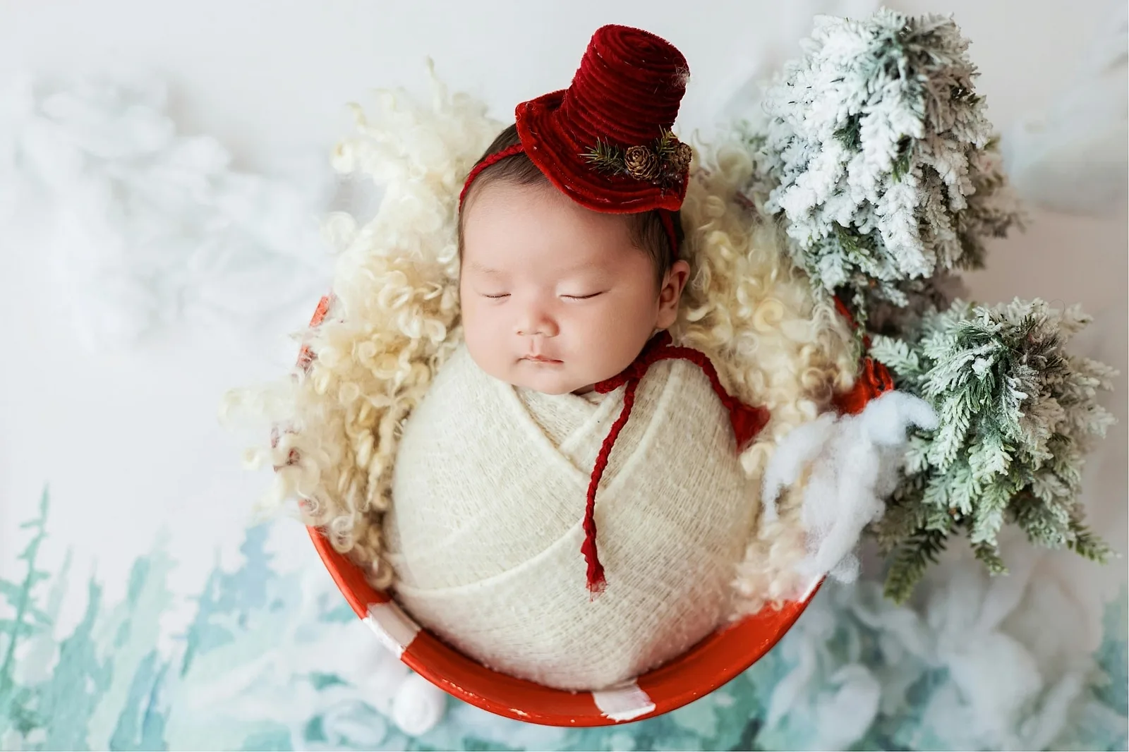 Baby in a Giant Christmas Ornament.