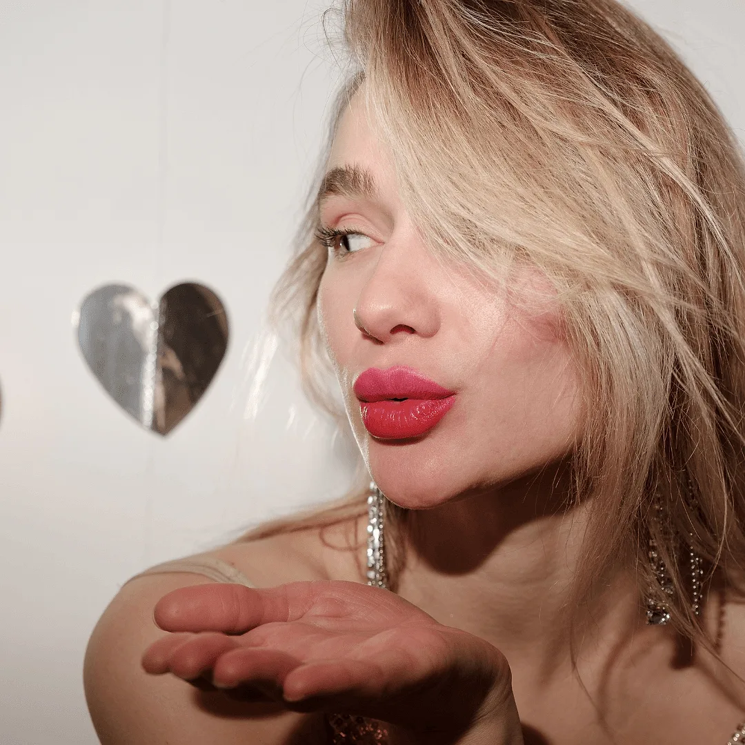 Pose #5: Blowing a Kiss.