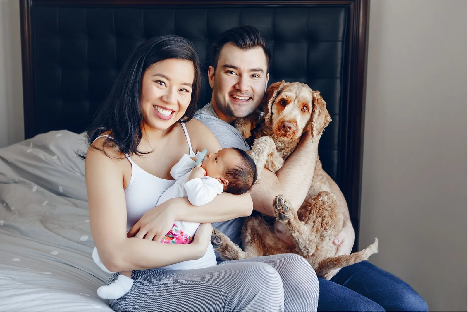 Cuddly Family on the Bed.