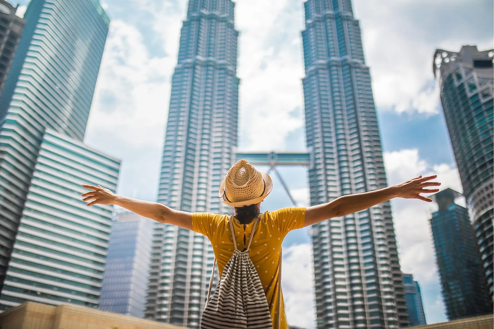 Solo traveler editorial portrait at Petronas Towers