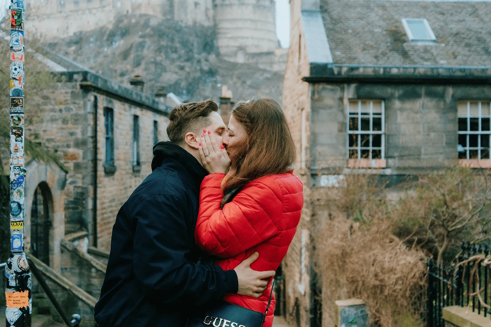 couple kissing in ediburgh during photoshoot with professional photographer