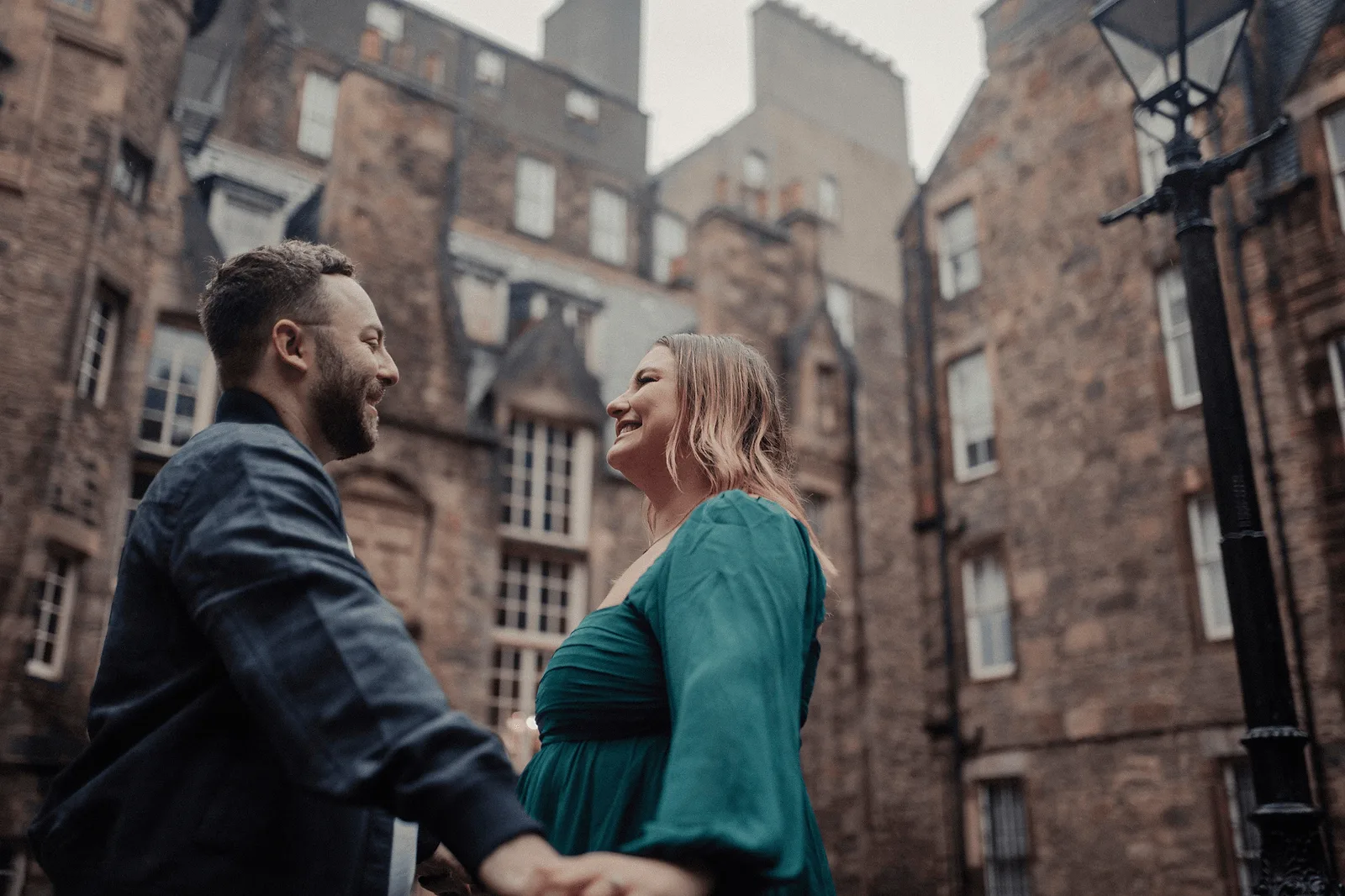 couple dancing in the rain in edinburgh