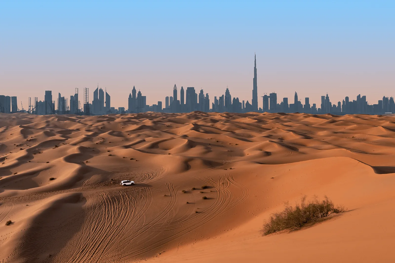 Dubai skyline and desert landscape.