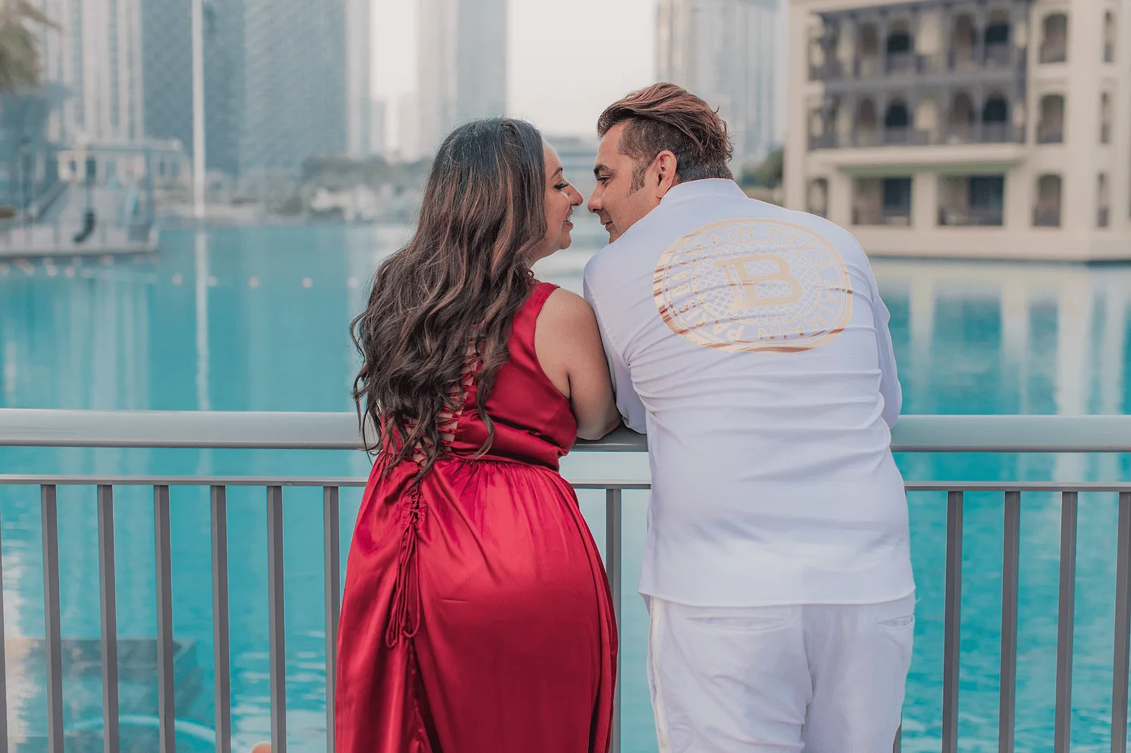 family photoshoot in dubai, man and woman leaning to each other