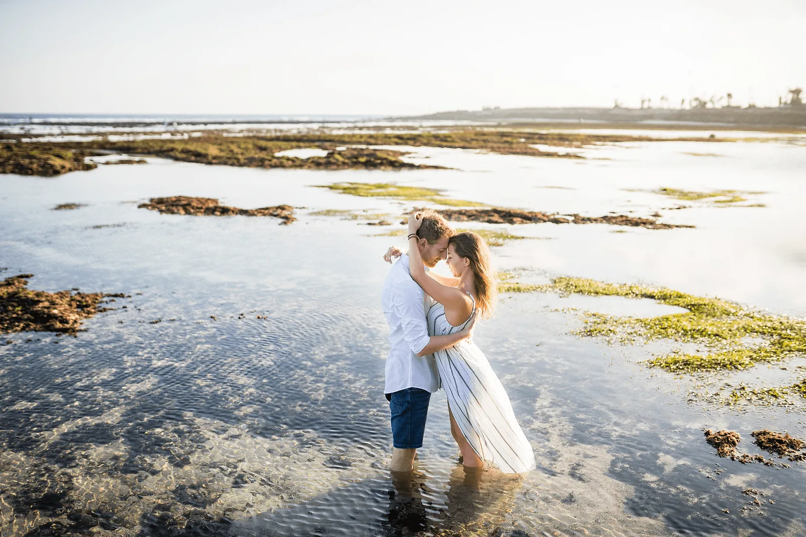 bali photoshoot with photographer: couple in early morning posing wearing white