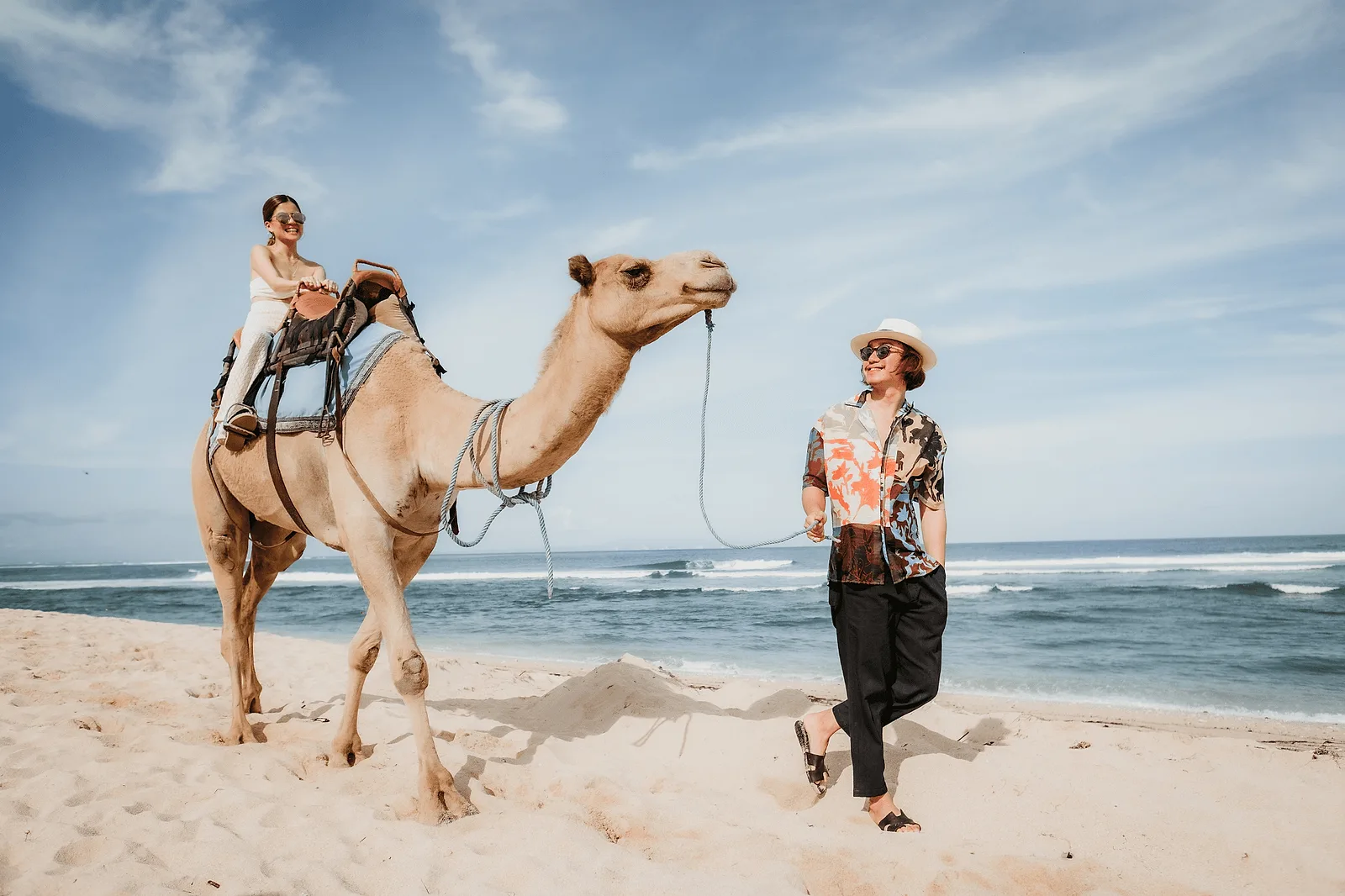 couple riding a camel during photoshoot in bali