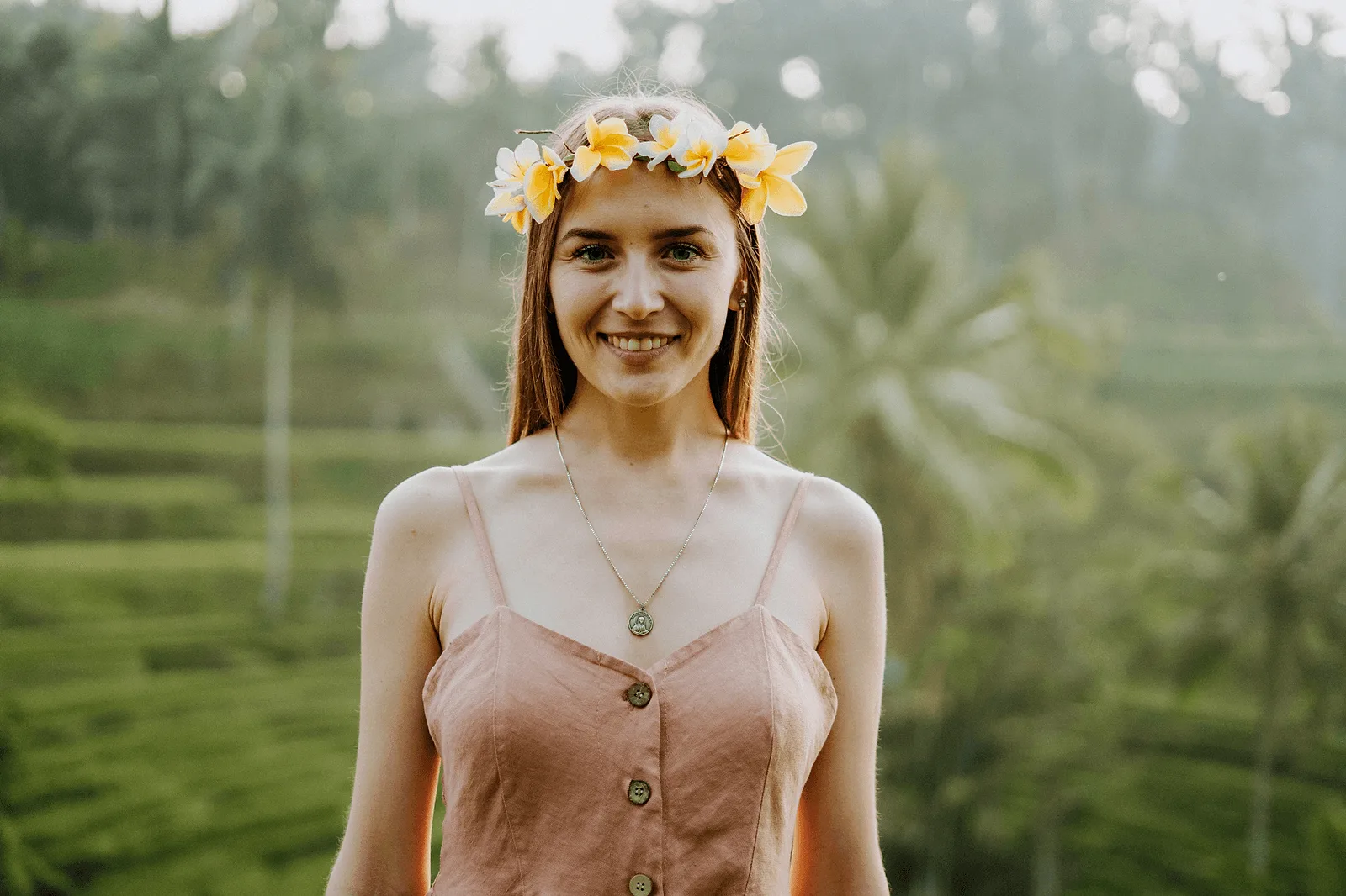 solo photoshoot in bali: woman with flowers on her head