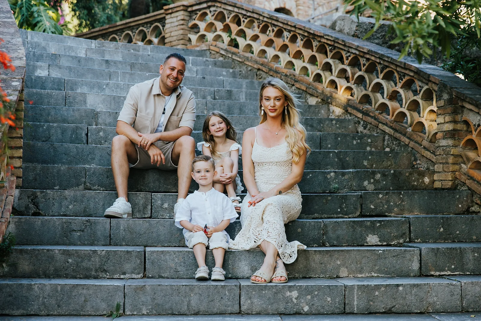 Family pictured on stairs in Taormina, Sicily