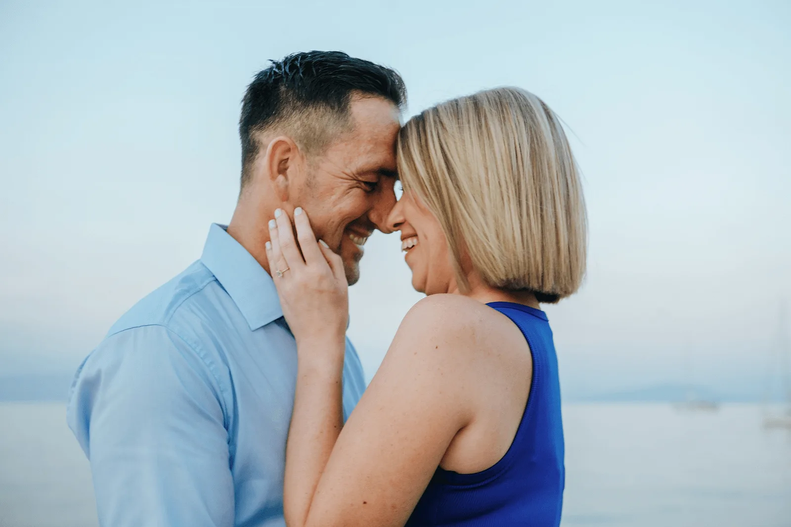couple sharing a romantic moment on a corfu beach 
