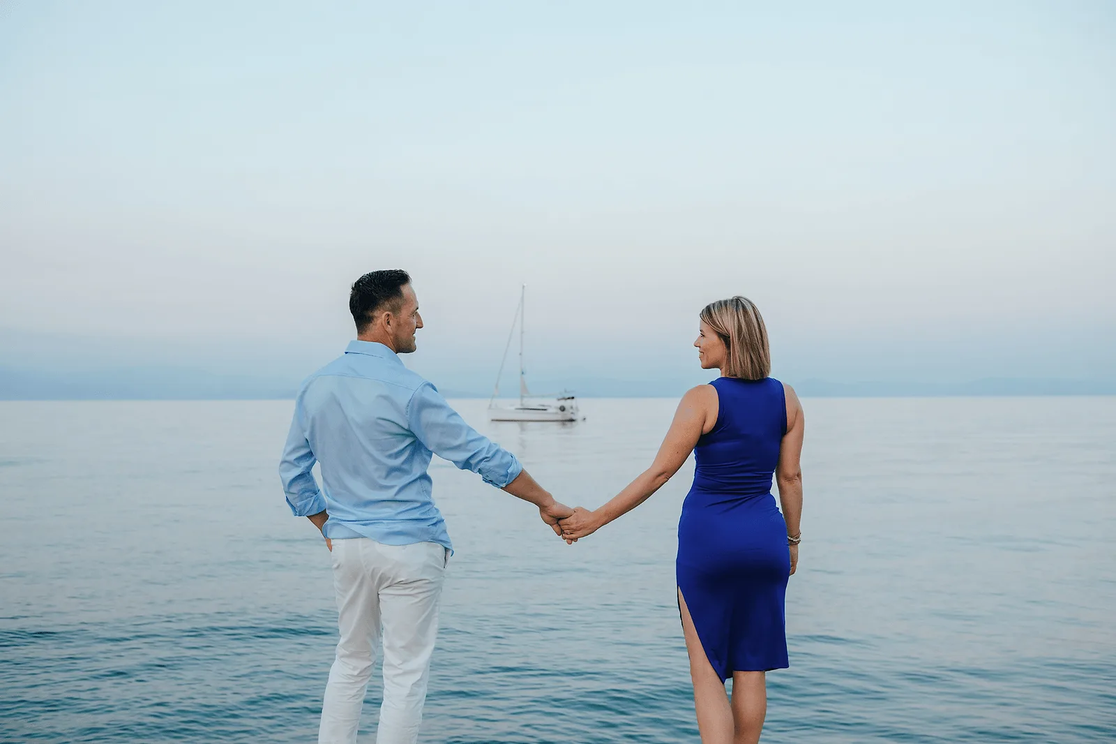 couple on corfu beach holding hands