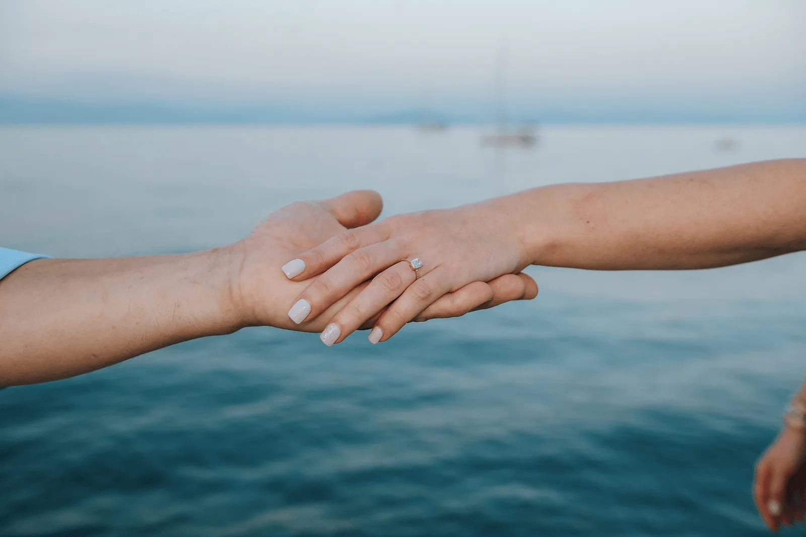 detail on holding hands after engagement