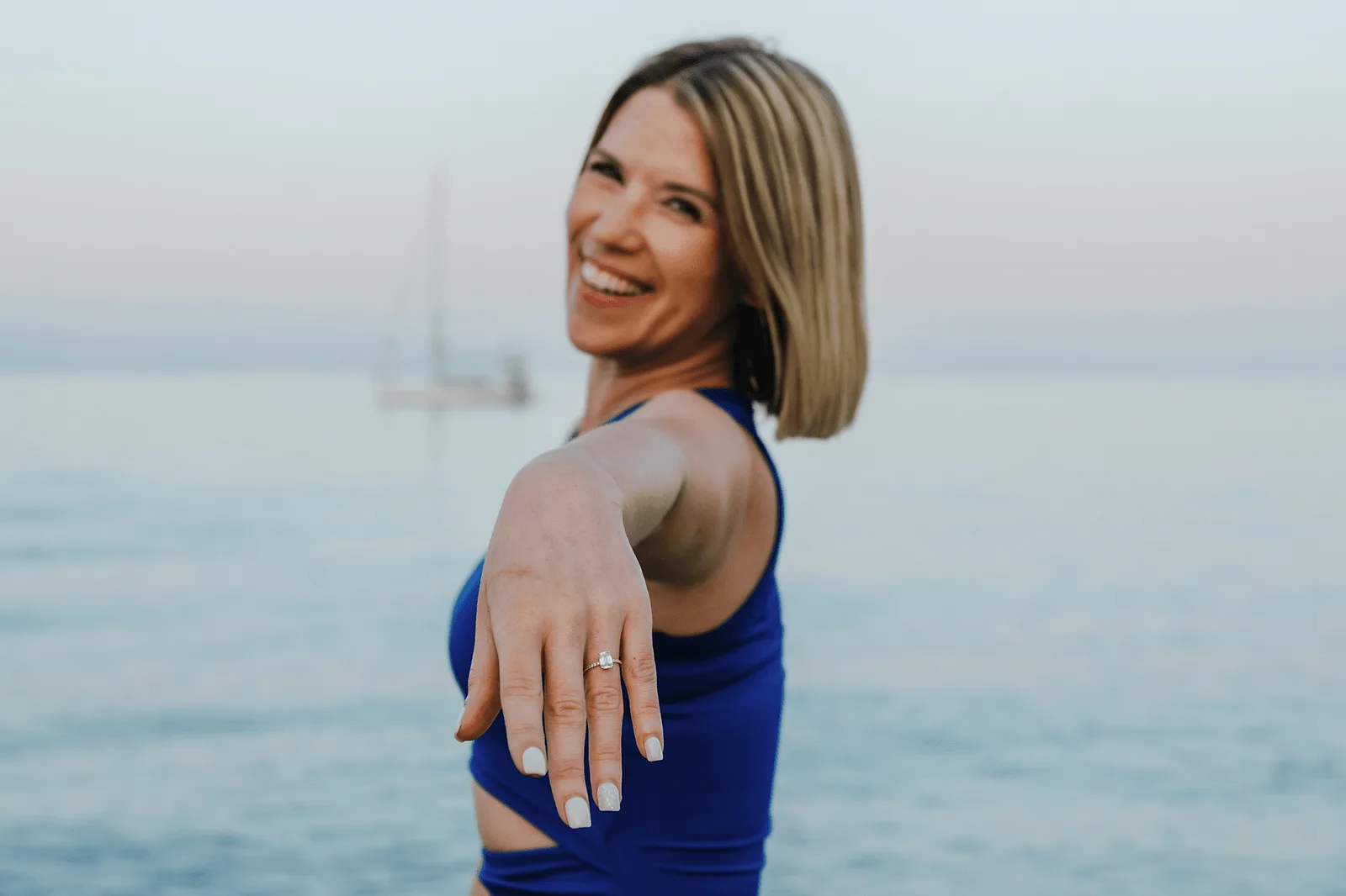 woman showing her new engagement ring in corfu