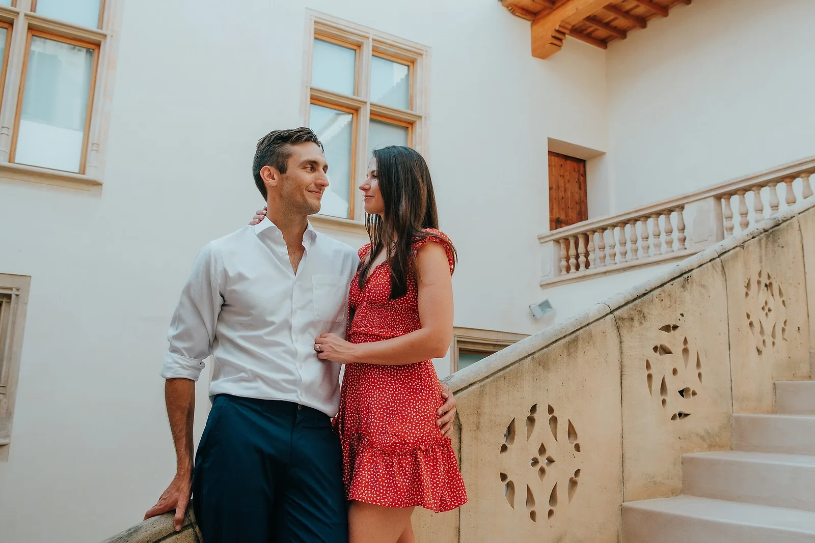 Couple posing on stairs in Mallorca