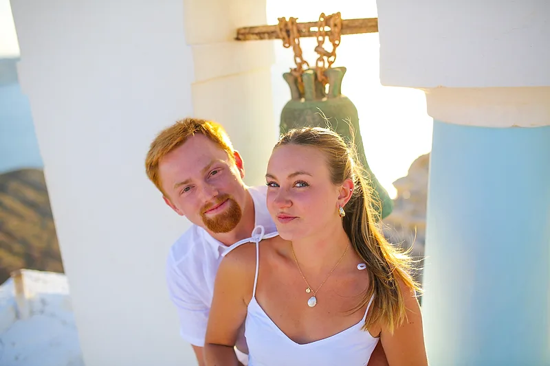 photo of a newly engaged ccouple taken in santorini greece