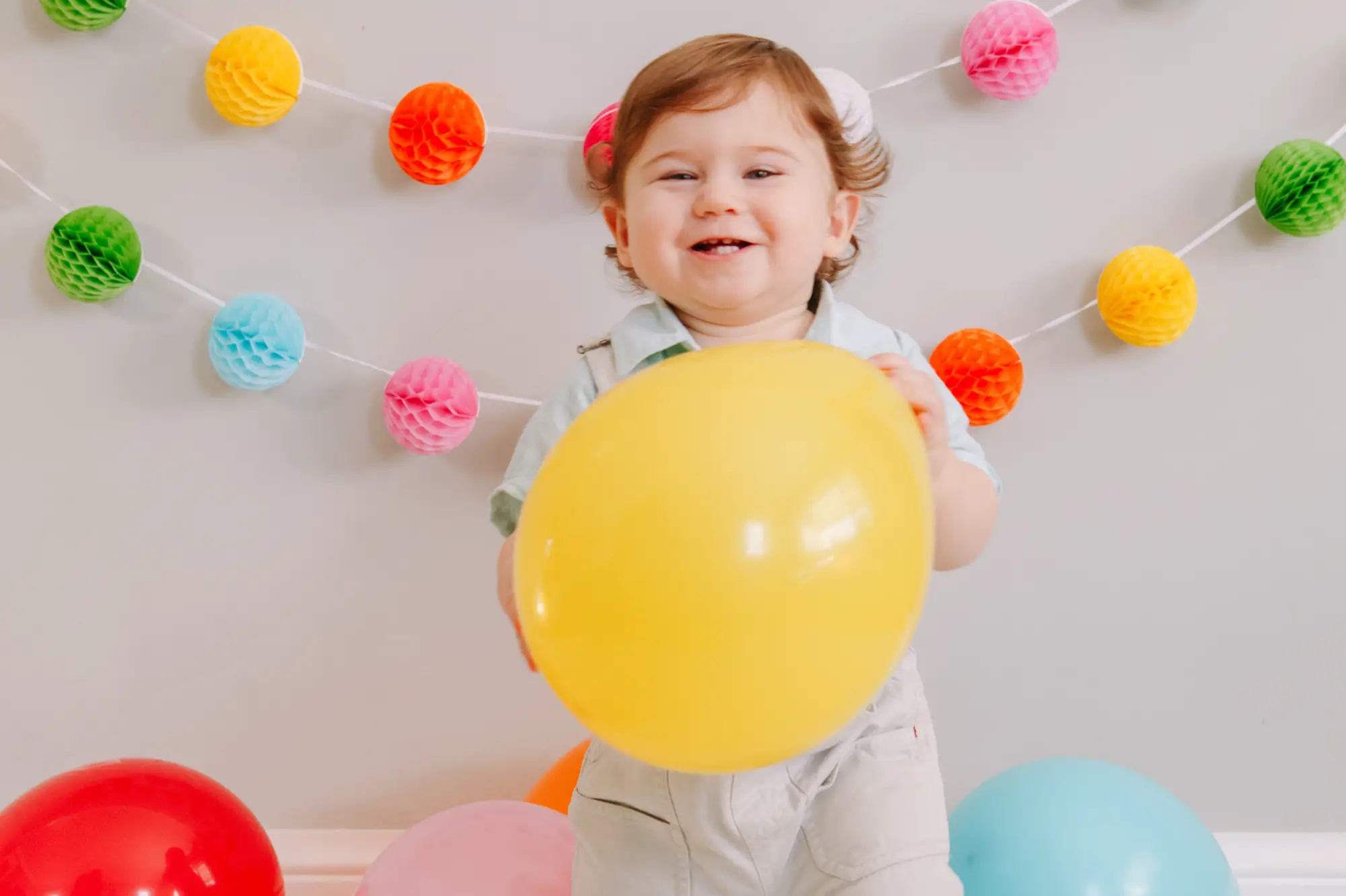 baby with balloons