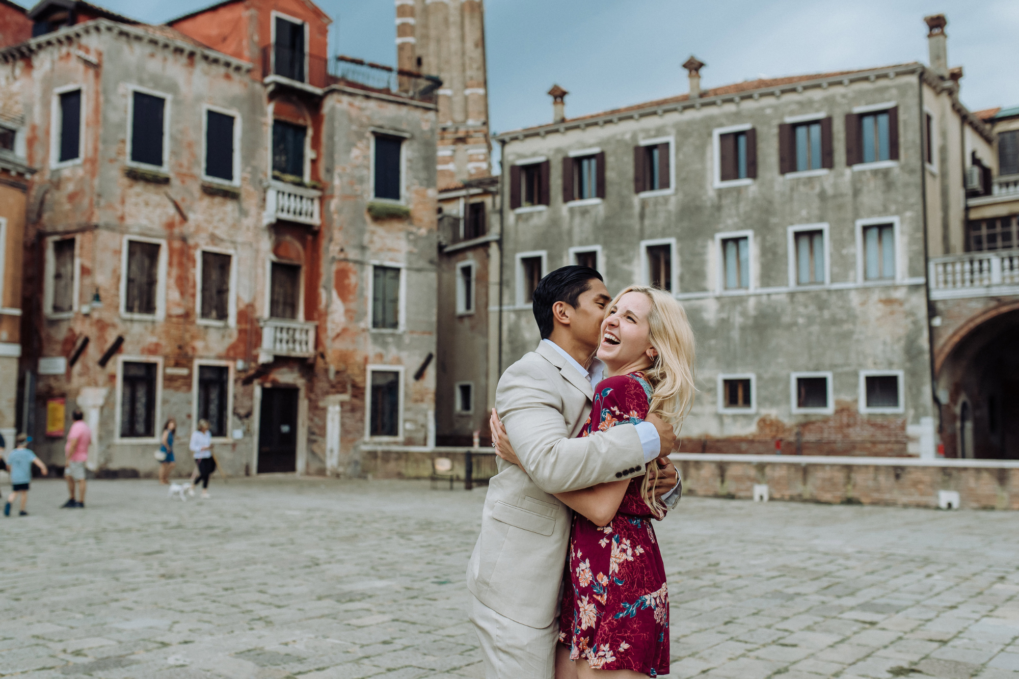 happy couple in venice during secret proposal session with prodessional photographer