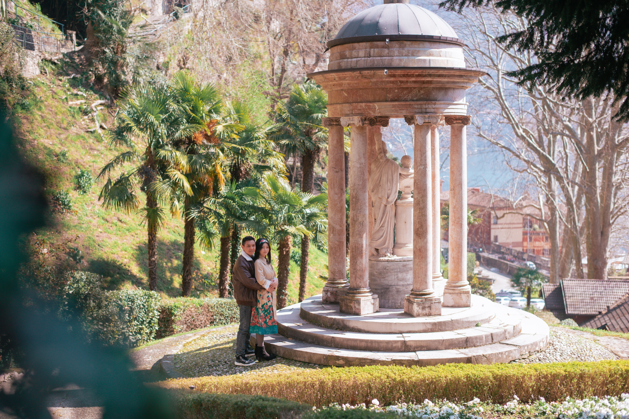 Couple in coordinated outfits during a professional photoshoot at Lake Como