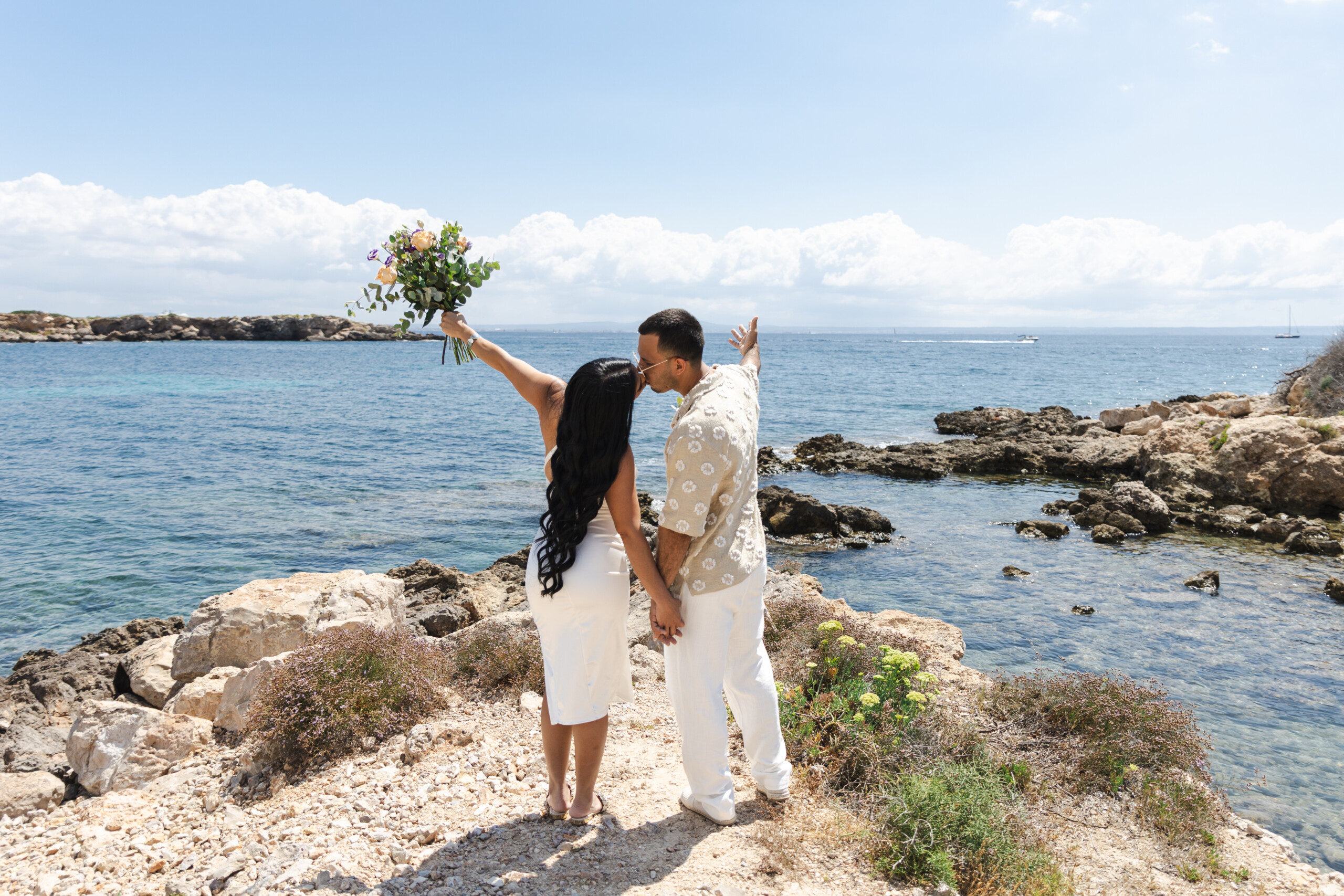 Couple facing the sea in Mallroca