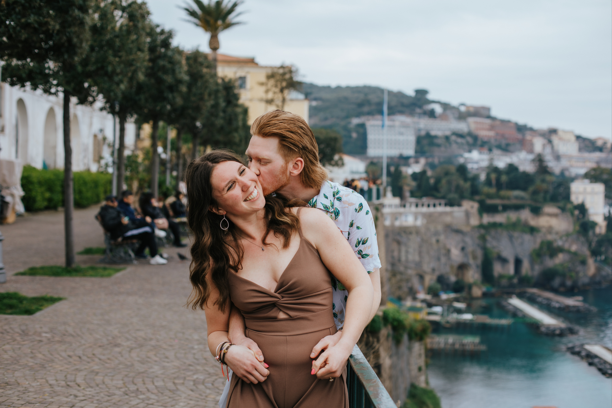 couple smiling and kissing during sorrento photoshoot