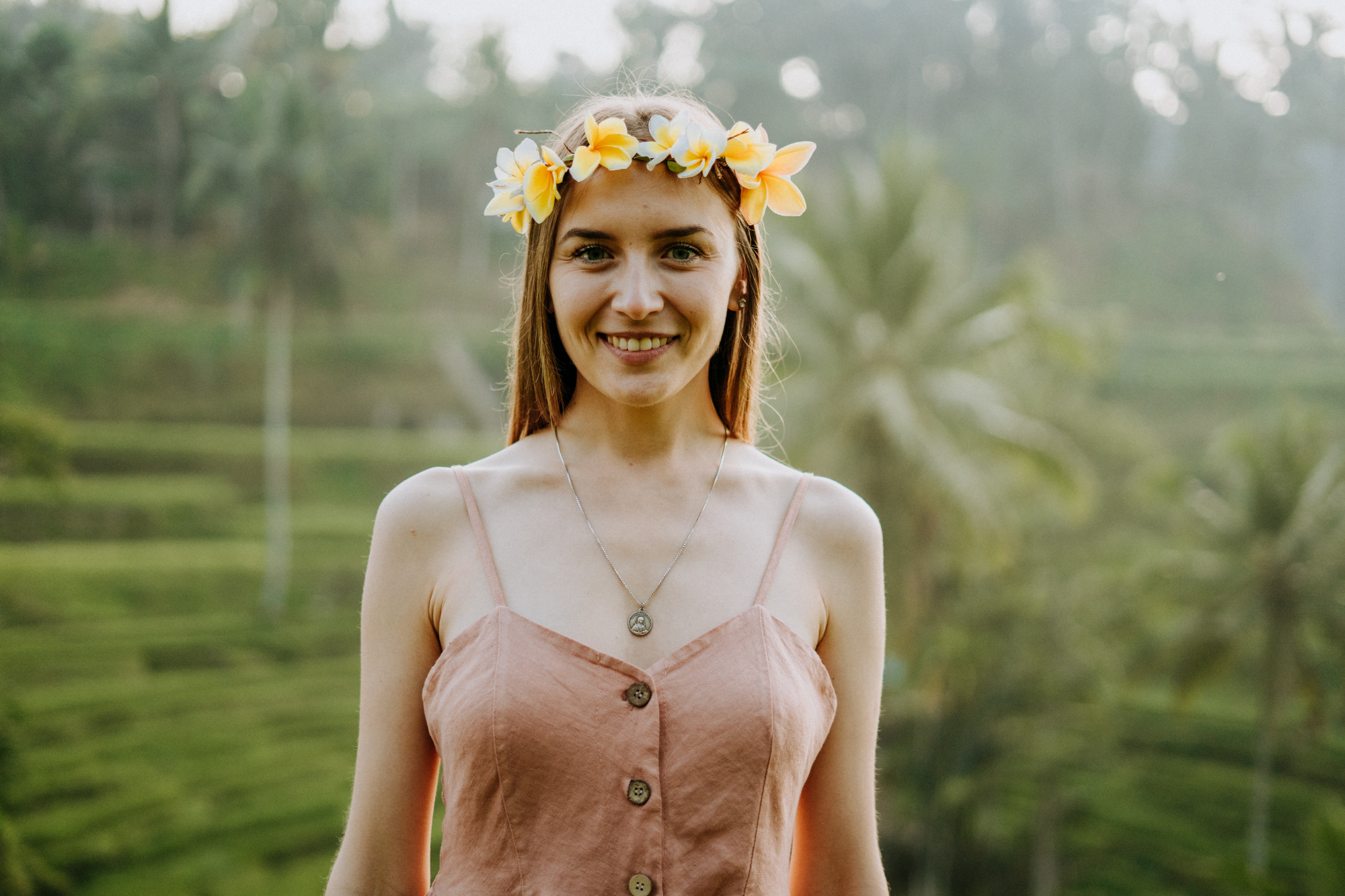 solo photoshoot in bali: woman with flowers on her head