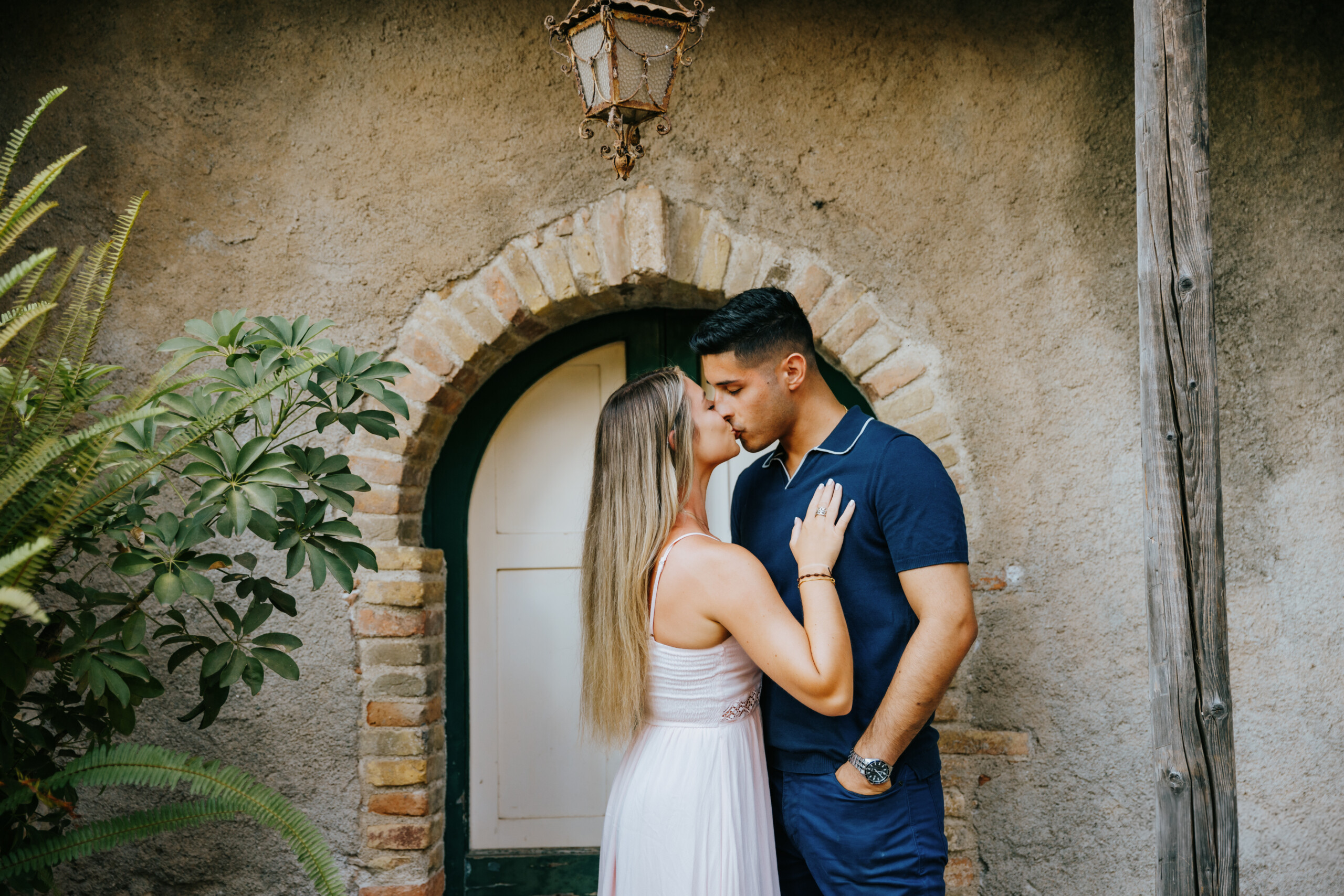 Couple kissing after proposal in Taormina