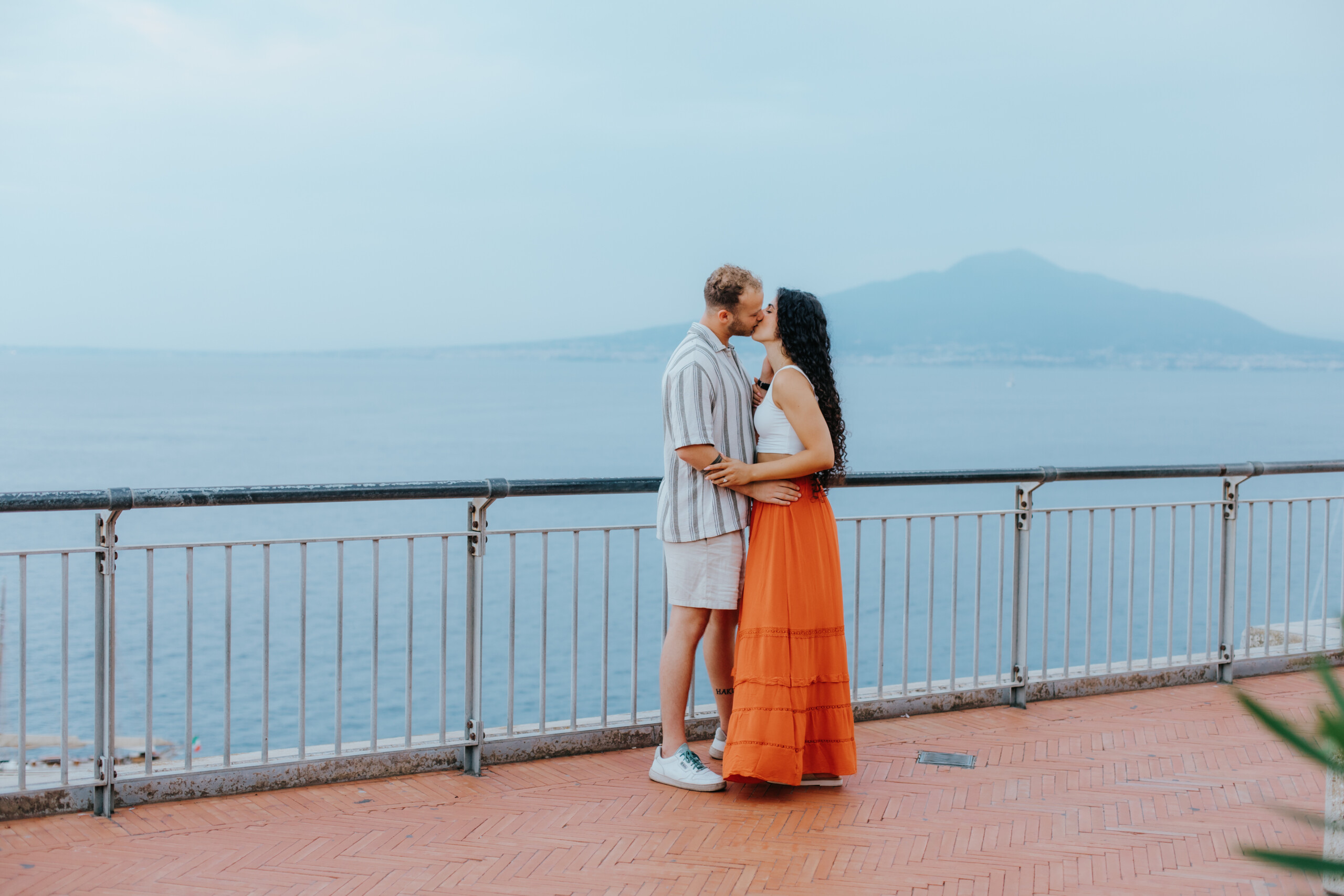 happy couple hugging and kissing at the Amalfi Coast