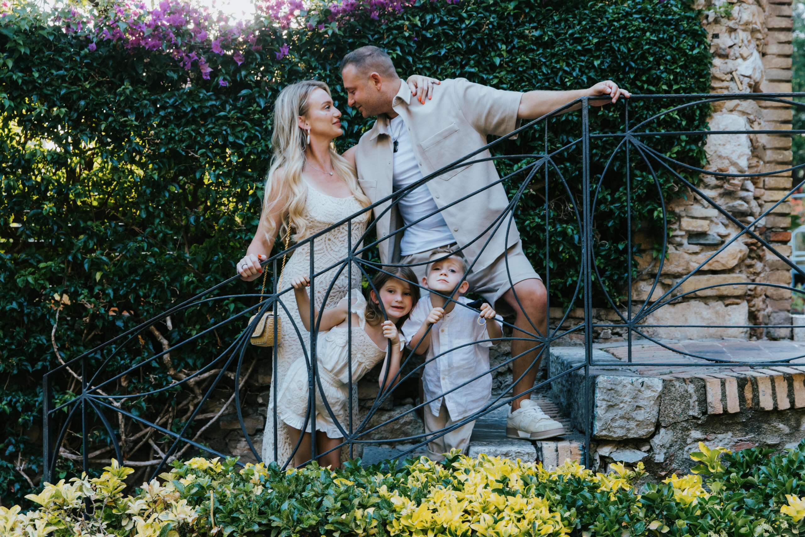 Family posing on stairs in Taormina, Sicily