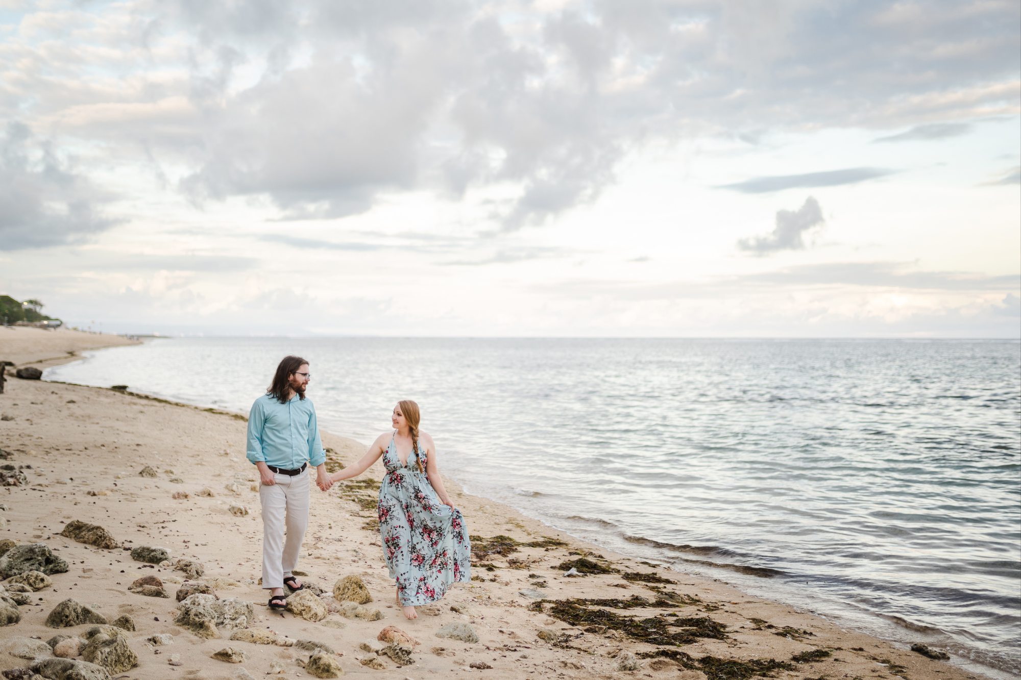 couple walking on the nusa dua beach