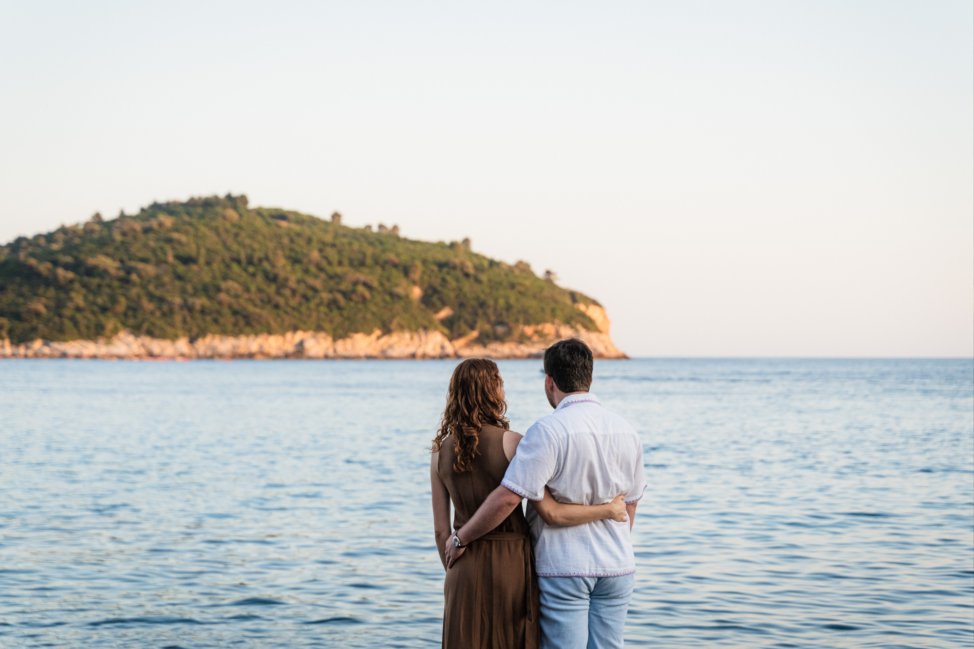 couple facing an island in dubrovnik