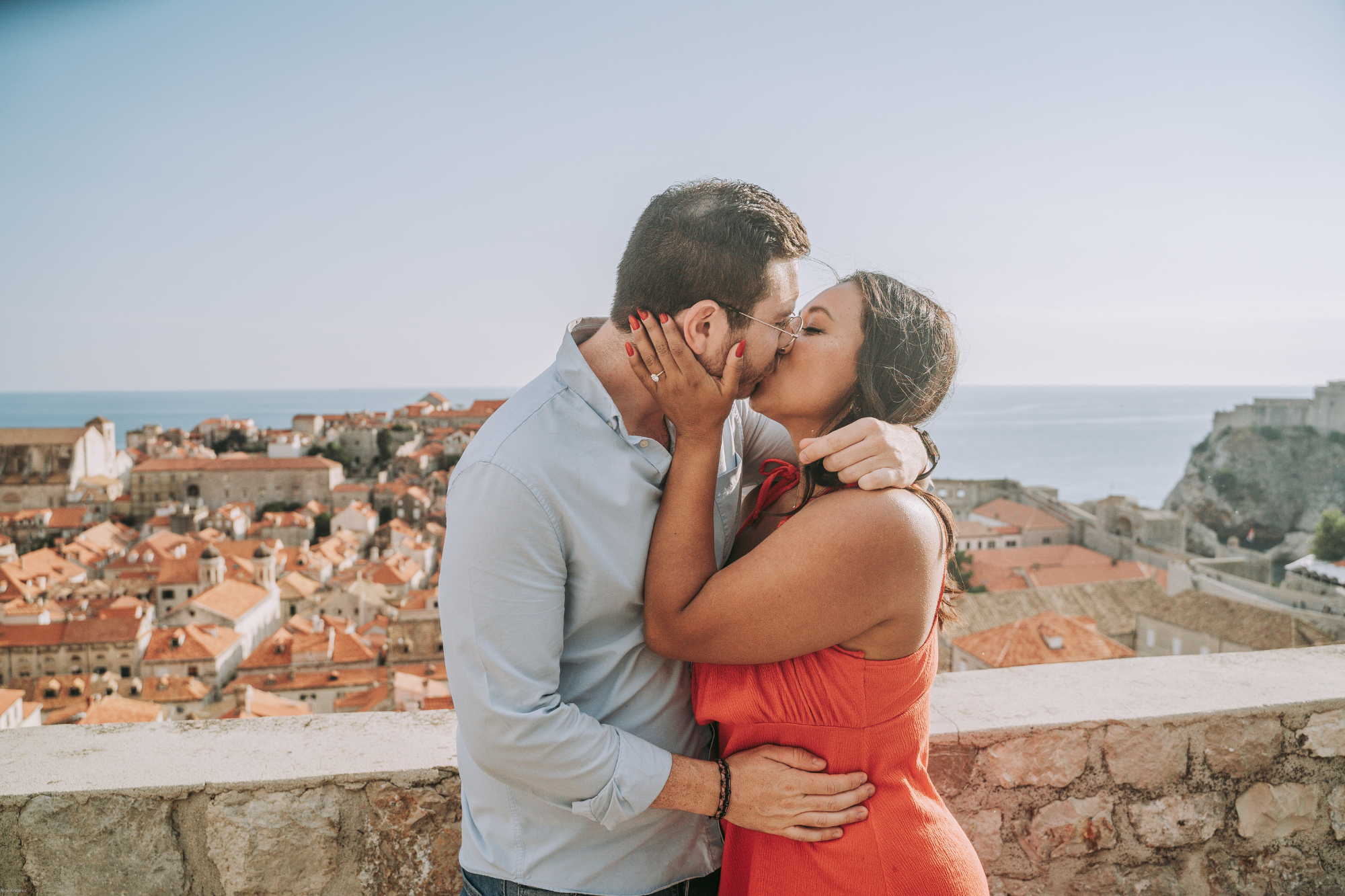 couple sharing a kiss after engagement in dubrovnik
